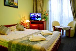 Posteľ alebo postele v izbe v ubytovaní Hotel Spinaker