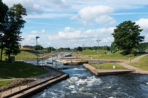 a river with several locks in a park at Holme Pierrepont Country Park Home of The National Water Sports Centre in Nottingham