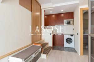 a laundry room with a washer and dryer at Vacation house with garden in the foothills in Barcelona