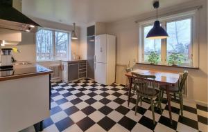 a kitchen with a black and white checkered floor at Pet Friendly Home In Vara With Wifi in Vara