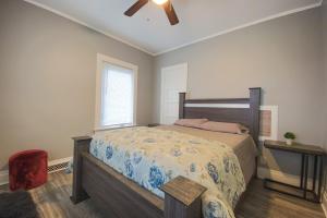a bedroom with a bed and a ceiling fan at Large 6BR, 2 bath in Niagara Falls in Niagara Falls
