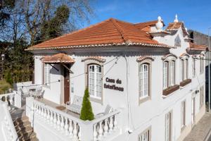 a white house with a red roof at Casa da Estefânea in Sintra