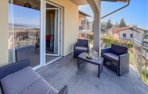 a patio with a couch and chairs on a balcony at 3 Bedroom Beautiful Home In Montebuono in San Savino