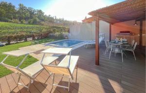 a patio with a table and chairs and a pool at 3 Bedroom Beautiful Home In Montebuono in San Savino