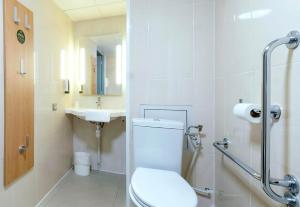 a bathroom with a toilet and a sink at B&B HOTEL La Rochelle Angoulins in Angoulins-sur-Mer