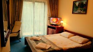 Posteľ alebo postele v izbe v ubytovaní Hotel Spinaker