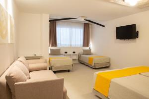 Μια τηλεόραση ή/και κέντρο ψυχαγωγίας στο Hotel Oasis Plaza