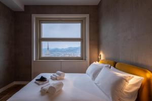 Posteľ alebo postele v izbe v ubytovaní Prestige Apartments Torino