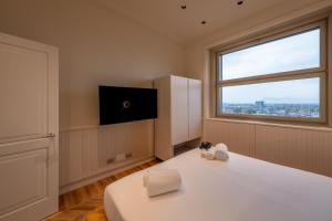 Posteľ alebo postele v izbe v ubytovaní Prestige Apartments Torino