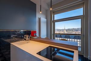 Kuchyňa alebo kuchynka v ubytovaní Prestige Apartments Torino