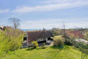 an aerial view of a house with a roof at Idyllic Holiday Home Near Cliffs And Beach in Gudhjem
