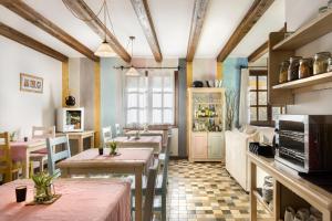 a restaurant with tables and chairs in a room at Hotel Rural El Mirador de los Pirineos in Santa Cruz de la Serós