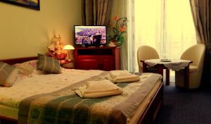 Posteľ alebo postele v izbe v ubytovaní Hotel Spinaker