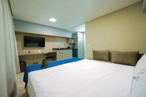 Apartamentos Studio Allure Moema - Com café da manhã opcional, Recepção e Valet 24 horas客房内的一张或多张床位