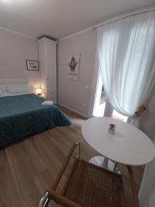 Postel nebo postele na pokoji v ubytování B&B Regina
