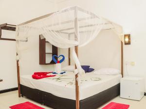 Postel nebo postele na pokoji v ubytování Canggu Surf Hotel