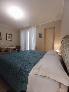 Postel nebo postele na pokoji v ubytování B&B Regina