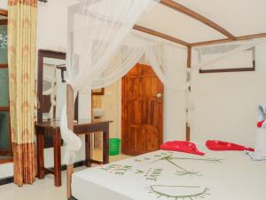 Postel nebo postele na pokoji v ubytování Canggu Surf Hotel