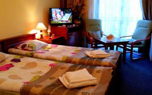 Posteľ alebo postele v izbe v ubytovaní Hotel Spinaker