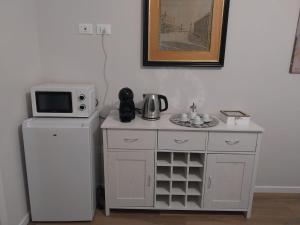 Kuchyň nebo kuchyňský kout v ubytování B&B Regina