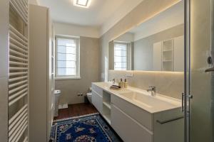 a bathroom with a sink and a mirror at Villa Ceratti in Cassano Magnago +35 photos
