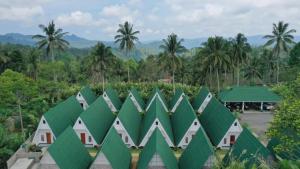 an image of a building with green roofs at Yanto Cottages in Lumajang