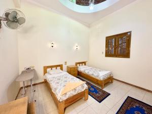 Ένα ή περισσότερα κρεβάτια σε δωμάτιο στο Sunset Haven Guesthouse +8 φωτογραφίες