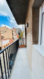 a balcony with a view of a city at MaiFamilyBCN-Cómodo Y Metro Cercano in Badalona