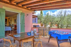 a patio with a table and a board game at VILLA IPAZIA 6, Emma Villas in Sonnino