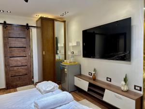 A television and/or entertainment centre at Shiny Pyramids "New Pyramids Gate"