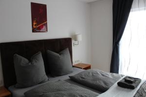 Postel nebo postele na pokoji v ubytování Burghotel - Das Original