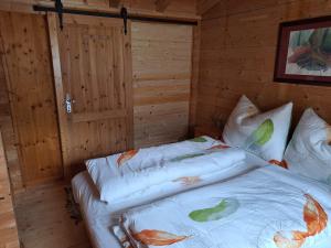 Ένα ή περισσότερα κρεβάτια σε δωμάτιο στο Chalet Siebenschläfer