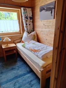 Ένα ή περισσότερα κρεβάτια σε δωμάτιο στο Chalet Siebenschläfer