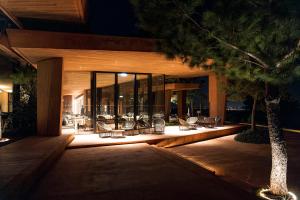 a building with a row of chairs on a patio at night at Palmares Signature Apartments in Lagos