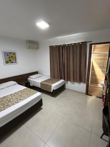 Postel nebo postele na pokoji v ubytování Hotel Holiday Foz