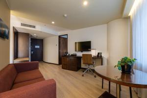 TV a/nebo společenská místnost v ubytování Hotel Estelar Milla De Oro