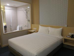 Postel nebo postele na pokoji v ubytování GTV Hotel