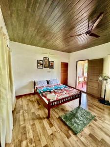 Postel nebo postele na pokoji v ubytování Mango Tree Villa