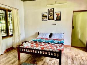 Postel nebo postele na pokoji v ubytování Mango Tree Villa