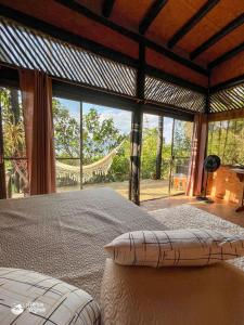 Ένα ή περισσότερα κρεβάτια σε δωμάτιο στο Chalés Ayty