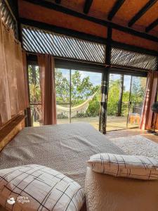 Ένα ή περισσότερα κρεβάτια σε δωμάτιο στο Chalés Ayty