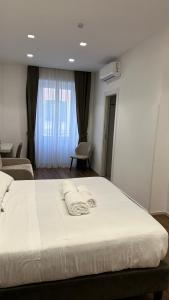Postel nebo postele na pokoji v ubytování AngelicaHome Roma