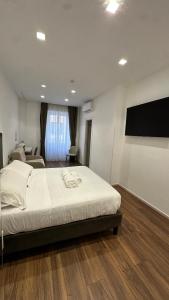 Postel nebo postele na pokoji v ubytování AngelicaHome Roma