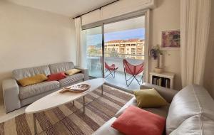 Χώρος καθιστικού στο Appartement vue sur les toits de Propriano
