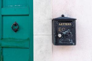 a post box next to a green door at Emidio e Carmen in Pescocostanzo +8 photos
