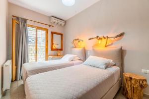 Postel nebo postele na pokoji v ubytování Kefalonia Apt