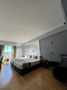 Postel nebo postele na pokoji v ubytování Hotel Onix