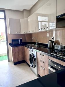 Kuchyň nebo kuchyňský kout v ubytování Appartement Agadir Bay 1 Piscine