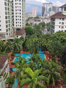 an aerial view of a resort with palm trees at Urban Oasis Apartment 6 in Melaka