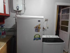 a refrigerator in a kitchen with stickers on it at ادفو 35سرير ثلاثي in Alexandria